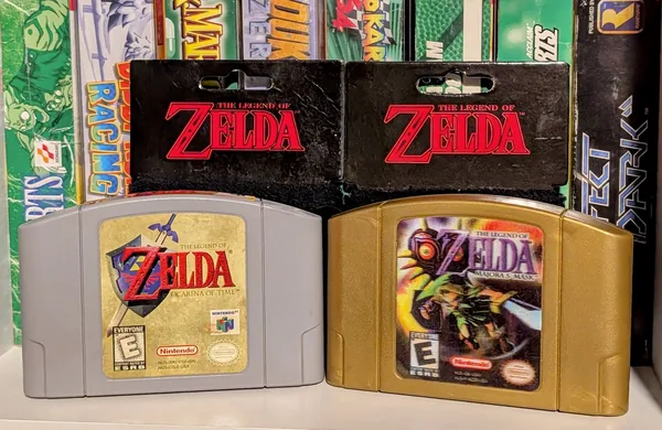 My gray Ocarina of Time cart next to my gold Majora's Mask cart